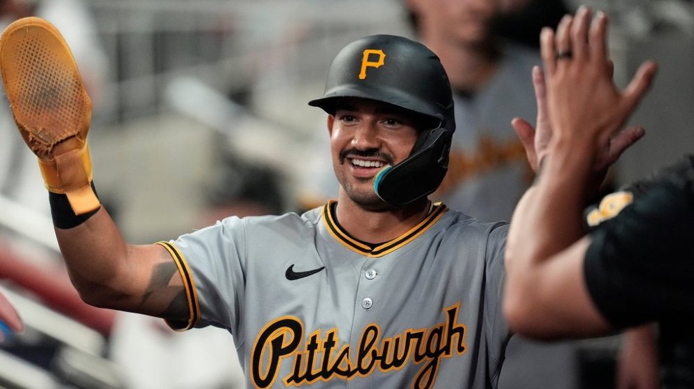 Pittsburgh Pirates' Nick Gonzales (39) celebrates scoring off the bat of Jack Suwinski in the sixth inning of a baseball game against the Atlanta Braves, Saturday, Sept. 27, 2025, in Atlanta. (AP Photo/Mike Stewart)
