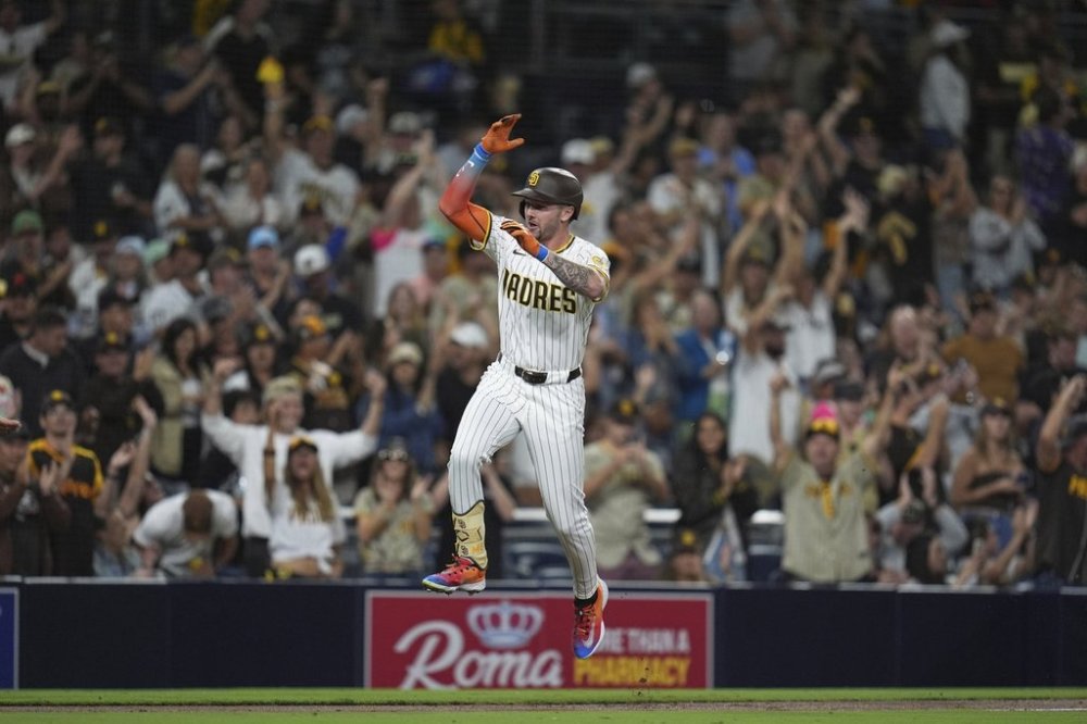 San Diego Padres' Jackson Merrill celebrates after hitting a home run during the fourth inning of a baseball game against the Colorado Rockies Thursday, Sept. 11, 2025, in San Diego. (AP Photo/Gregory Bull)