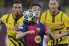 FILE - Barcelona's Gavi heads the ball during the Champions League quarterfinals second leg soccer match between Borussia Dortmund and Barcelona, at the Signa-Iduna Park in Dortmund, Germany, April 15, 2025. (AP Photo/Martin Meissner, File)