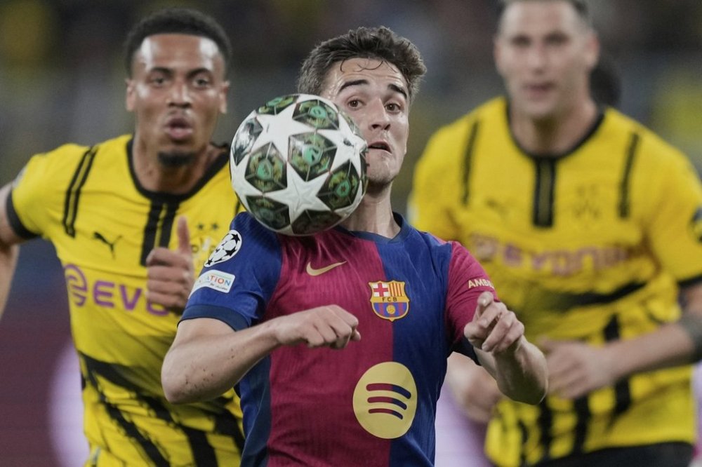 FILE - Barcelona's Gavi heads the ball during the Champions League quarterfinals second leg soccer match between Borussia Dortmund and Barcelona, at the Signa-Iduna Park in Dortmund, Germany, April 15, 2025. (AP Photo/Martin Meissner, File)