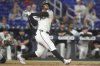 Miami Marlins' Xavier Edwards hits a three-run home run during the eighth inning of a baseball game against the Washington Nationals Wednesday, Sept. 10, 2025, in Miami. (AP Photo/Marta Lavandier)