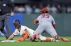 San Francisco Giants' Casey Schmitt slides into second base with a double as St. Louis Cardinals' Brendan Donovan applies a late tag in 2nd inning during MLB game in San Francisco on Wednesday, Sept. 24, 2025. (Scott Strazzante/San Francisco Chronicle via AP)