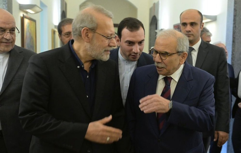 In this photo released by the Lebanese Government Press Office, Lebanese Prime Minister Nawaf Salam, right, speaks with Iranian Secretary of Supreme National Security Council Ali Larijani, at the government palace in Beirut, Lebanon, Saturday, Sept. 27, 205. (Lebanese Government Press Office via AP)