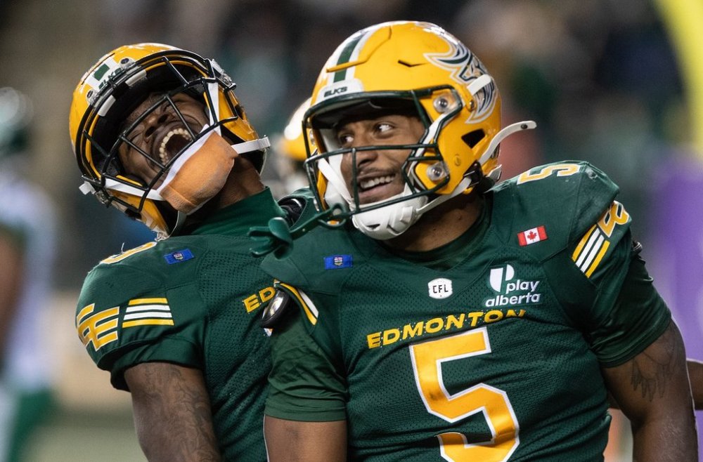 Edmonton Elks' Justin Rankin (5) and Kurleigh Gittens Jr. (19) celebrate a touchdown against the Saskatchewan Roughriders during second-half CFL action in Edmonton, on Saturday, Sept. 27, 2025. THE CANADIAN PRESS/Jason Franson