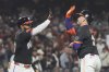 San Francisco Giants' Patrick Bailey, right, is congratulated by Heliot Ramos after hitting a home run against the Arizona Diamondbacks during the fifth inning of a baseball game in San Francisco, Tuesday, Sept. 9, 2025. (AP Photo/Jeff Chiu)