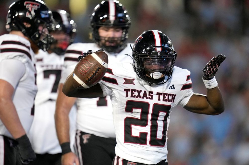 Texas Tech running back J'Koby Williams (20) celebrates his touchdown against Houston during the first half of an NCAA college football game, Saturday, Oct. 4, 2025, in Houston. (AP Photo/Karen Warren)