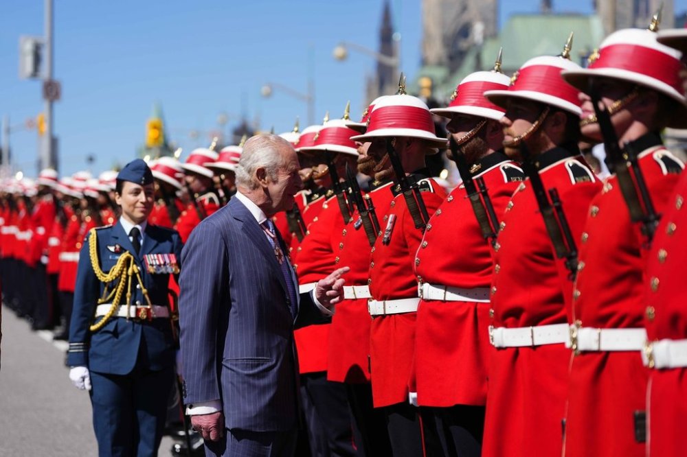 King Charles inspects an honour guard at the Senate of Canada building in Ottawa during a royal visit on Tuesday, May 27, 2025. THE CANADIAN PRESS/Justin Tang