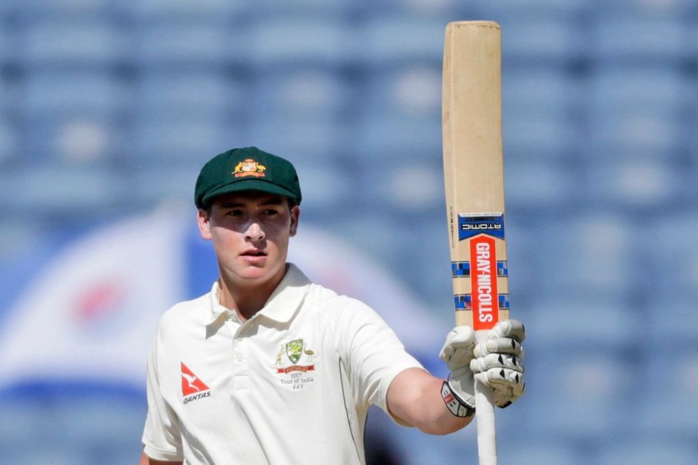FILE - Australia's Matthew Renshaw celebrates his fifty during the first day of the first test cricket match against India in Pune, India, on Feb. 23, 2017. (AP Photo/Rajanish Kakade, File)