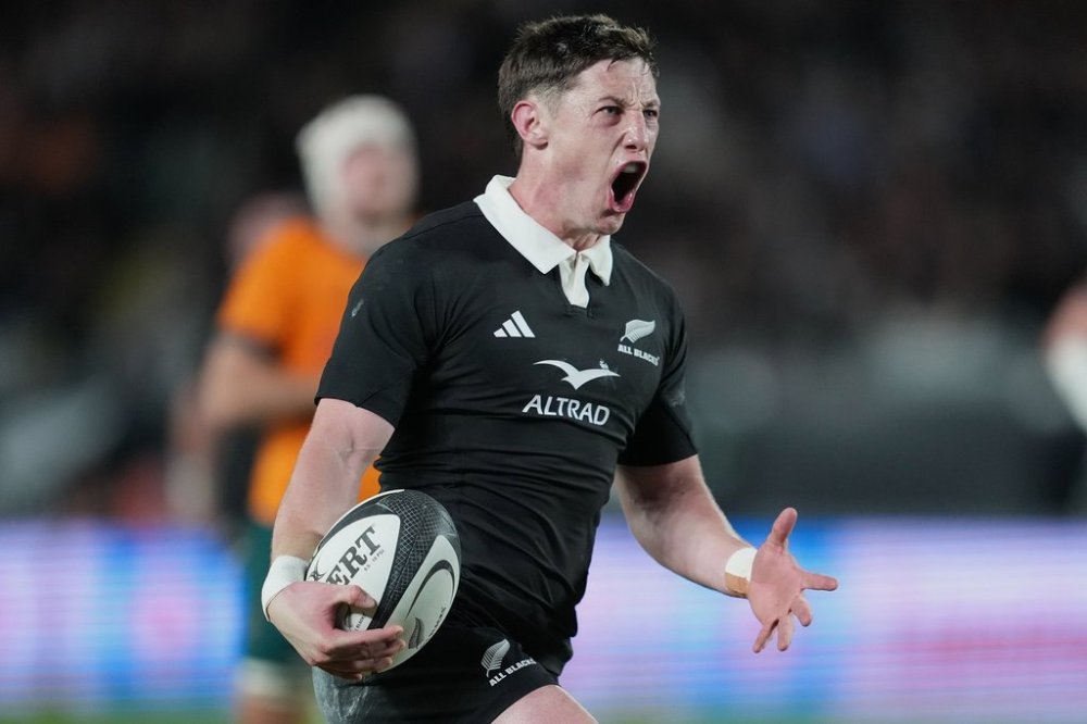 New Zealand's Cam Roigard reacts after scoring a try during the Bledisloe Rugby test between the All Blacks and the Wallabies at Eden Park in Auckland, New Zealand, Saturday, Sept. 27, 2025. (Marty Melville/Photosport via AP)