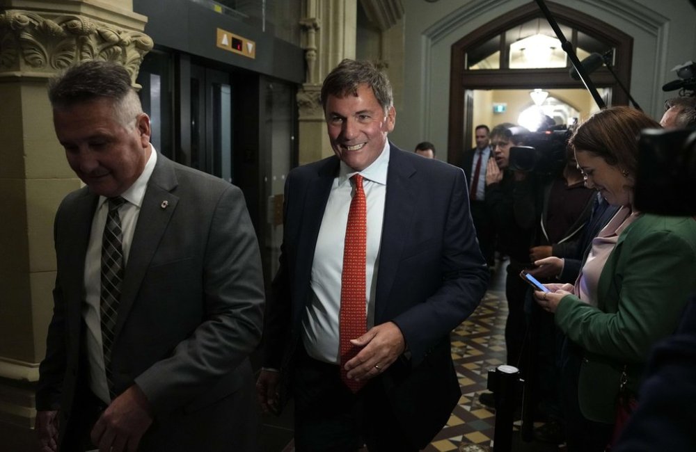 Intergovernmental Affairs Minister Dominic LeBlanc and Minister of Agriculture and Agri-Food Heath MacDonald, left, make their way to a meeting of the Liberal caucus on Wednesday, Oct. 1, 2025. THE CANADIAN PRESS/Justin Tang