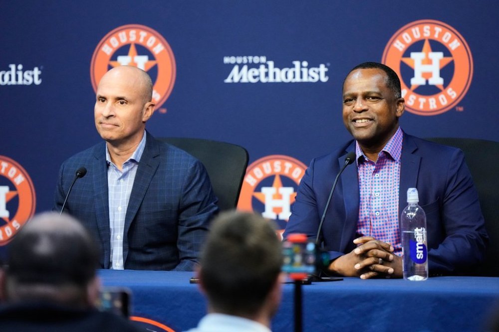 Houston Astros Manager Joe Espada, left, and General Manager Dana Brown speak to reporters during an MLB postseason press conference in Houston, Tuesday, Sept. 30, 2025. (AP Photo/Ashley Landis)