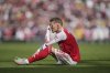 Arsenal's Martin Odegaard sits injred during the Premier League soccer match between Arsenal and Nottingham Forest in London, Saturday, Sept. 13, 2025. (AP Photo/Kin Cheung)