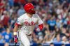 Philadelphia Phillies designated hitter Kyle Schwarber watches his ball after hitting a solo home run in the third inning of a baseball game against the Miami Marlins, Wednesday, Sept. 24, 2025, in Philadelphia. (AP Photo/Laurence Kesterson)