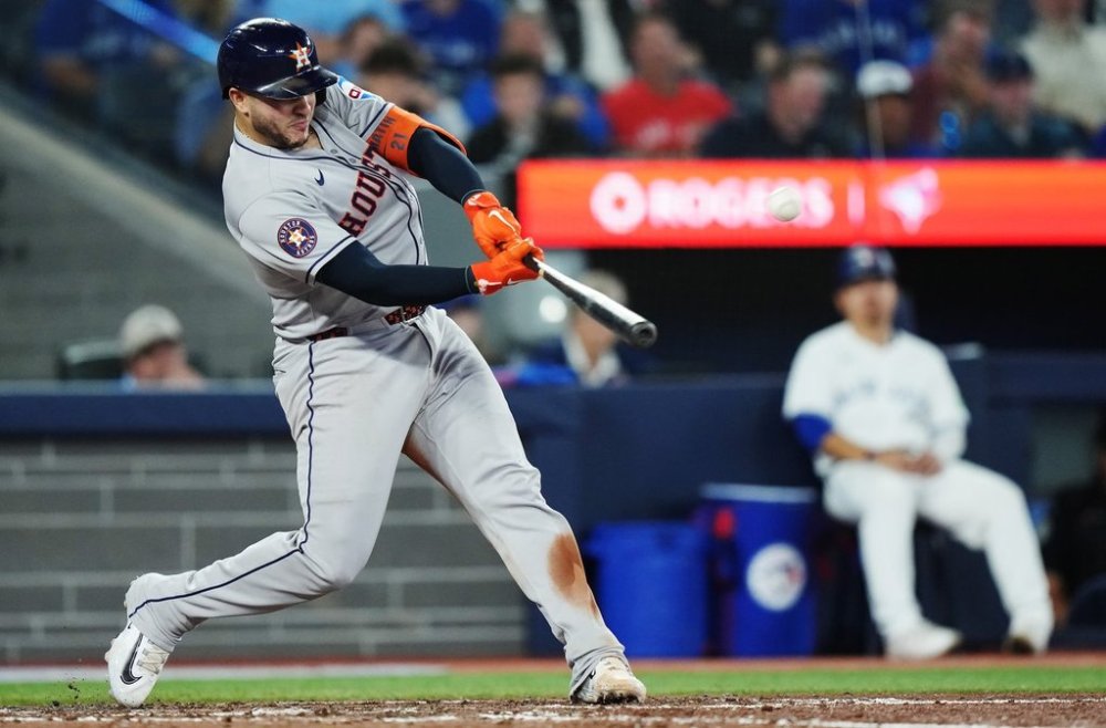 Houston Astros' Yainer Diaz (21) hits a solo home run against the Toronto Blue Jays during ninth inning MLB baseball action in Toronto on Wednesday, September 10, 2025. THE CANADIAN PRESS/Nathan Denette