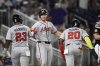 Atlanta Braves' Matt Olson, center, celebrates after his three-run home run with Marcell Ozuna (20) and Michael Harris II (23) during the fifth inning of a baseball game against the Washington Nationals, Monday, Sept. 15, 2025, in Washington. (AP Photo/Nick Wass)