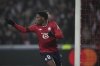 Lille's Jonathan David celebrates after scoring the opening goal during the Champions League opening phase soccer match between Lille and Juventus at the Stade Pierre Mauroy in Villeneuve-d'Ascq, outside Lille, France, Tuesday, Nov. 5, 2024. (AP Photo/Christophe Ena)