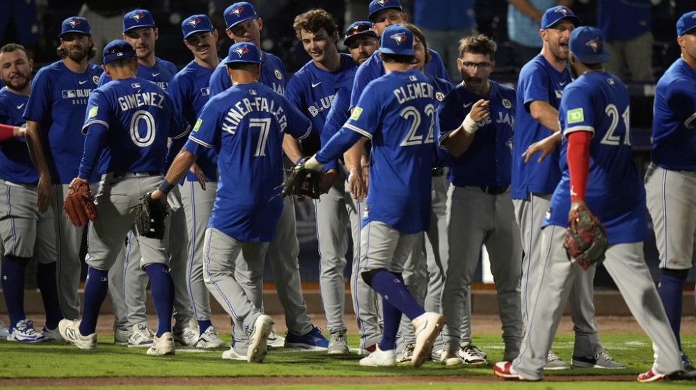 Toronto Blue Jays players celebrate after defeating the Tampa Bay Rays in a Major League Baseball game on Monday, Sept. 15, 2025, in Tampa, Fla. (AP Photo/Chris O'Meara)
