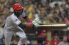 Cincinnati Reds' Elly De La Cruz watches his RBI single during the eighth inning of a baseball game against the San Diego Padres Wednesday, Sept. 10, 2025, in San Diego. (AP Photo/Gregory Bull)