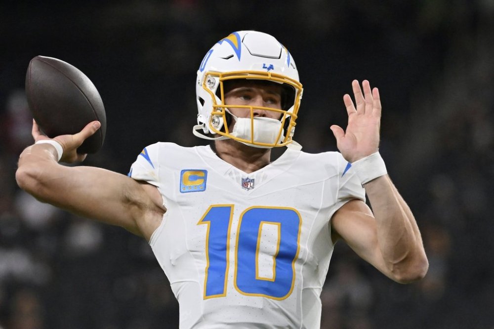 Los Angeles Chargers quarterback Justin Herbert (10) warms up before an NFL football game, Monday, Sept. 15, 2025, in Las Vegas. (AP Photo/David Becker)