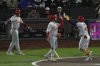 St. Louis Cardinals' Iván Herrera, right, is congratulated by Alec Burleson, middle, after hitting a two-run home run that also scored Lars Nootbaar, left, during the fifth inning of a baseball game against the San Francisco Giants in San Francisco, Monday, Sept. 22, 2025. (AP Photo/Godofredo A. Vásquez)