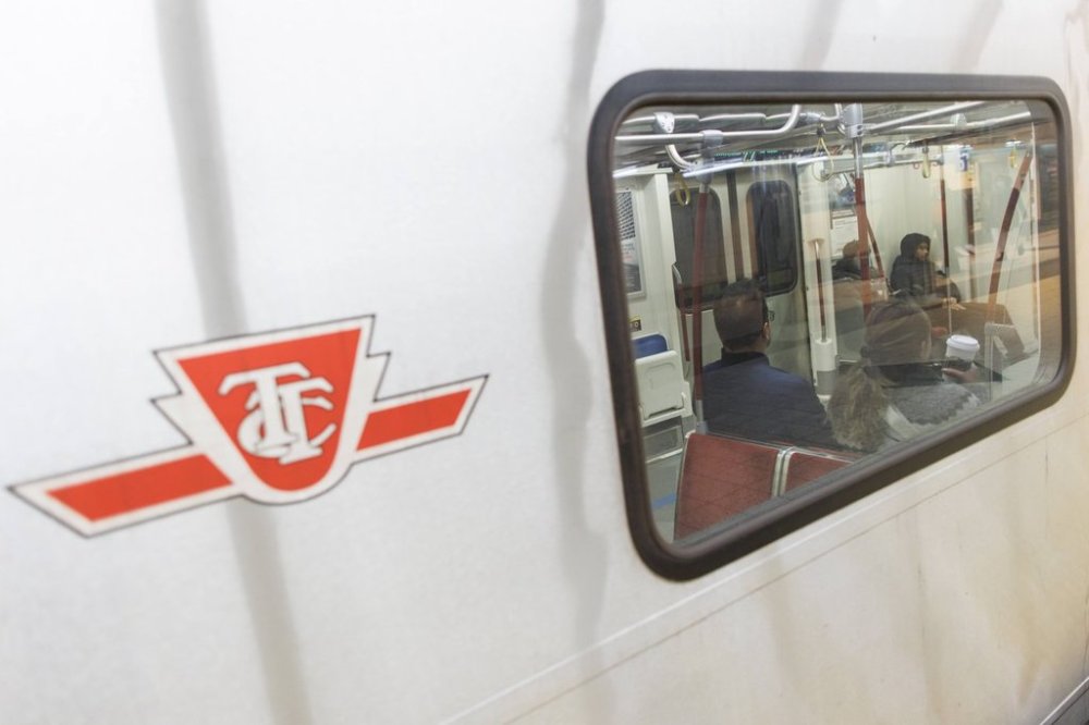 Riders take a subway train on the Toronto Transit Commission station in downtown Toronto, Saturday, Apr. 1, 2023. THE CANADIAN PRESS/Cole Burston