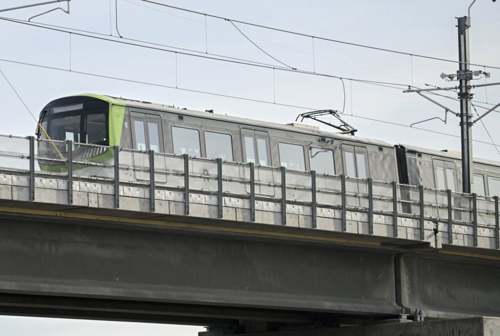 A REM train is shown being tested on a track in Montreal, Tuesday, May 2, 2023. THE CANADIAN PRESS IMAGES/Graham Hughes