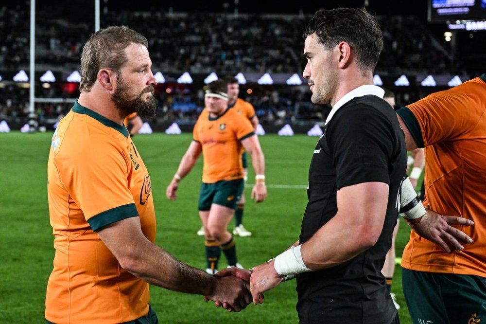 Australia's James Slipper, left, shakes hands with New Zealand's Will Jordan following the Bledisloe Rugby test between the All Blacks and the Wallabies at Eden Park in Auckland, New Zealand, Saturday, Sept. 27, 2025. (Andrew Cornaga/Photosport via AP)