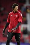 Manchester United's goalkeeper Senne Lammens stands on the pitch prior to start of the English Premier League soccer match between Manchester United and Chelsea at the Old Trafford stadium in Manchester, England, Saturday, Sept. 20, 2025. (AP Photo/Dave Thompson)