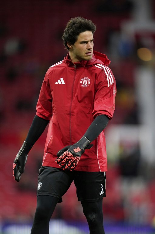 Manchester United's goalkeeper Senne Lammens stands on the pitch prior to start of the English Premier League soccer match between Manchester United and Chelsea at the Old Trafford stadium in Manchester, England, Saturday, Sept. 20, 2025. (AP Photo/Dave Thompson)