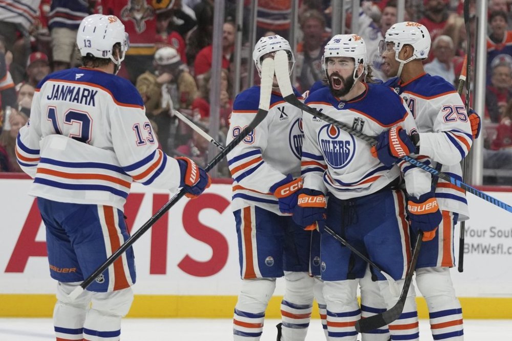 Edmonton Oilers defenceman Jake Walman (96) celebrates his goal during the third period of Game 4 of the NHL hockey Stanley Cup Final against the Florida Panthers, Thursday, June 12, 2025, in Sunrise, Fla. (AP Photo/Lynne Sladky)