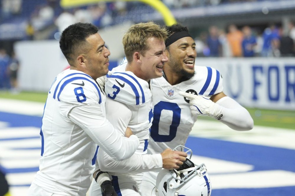 Indianapolis Colts place kicker Spencer Shrader (3) celebrates Sith Rigoberto Sanchez (8) and Cam Bynum (0) after Schrader kicked a game winning field goal during the second half an NFL football game against the Denver Broncos, Sunday, Sept. 14, 2025, in Indianapolis. (AP Photo/AJ Mast)