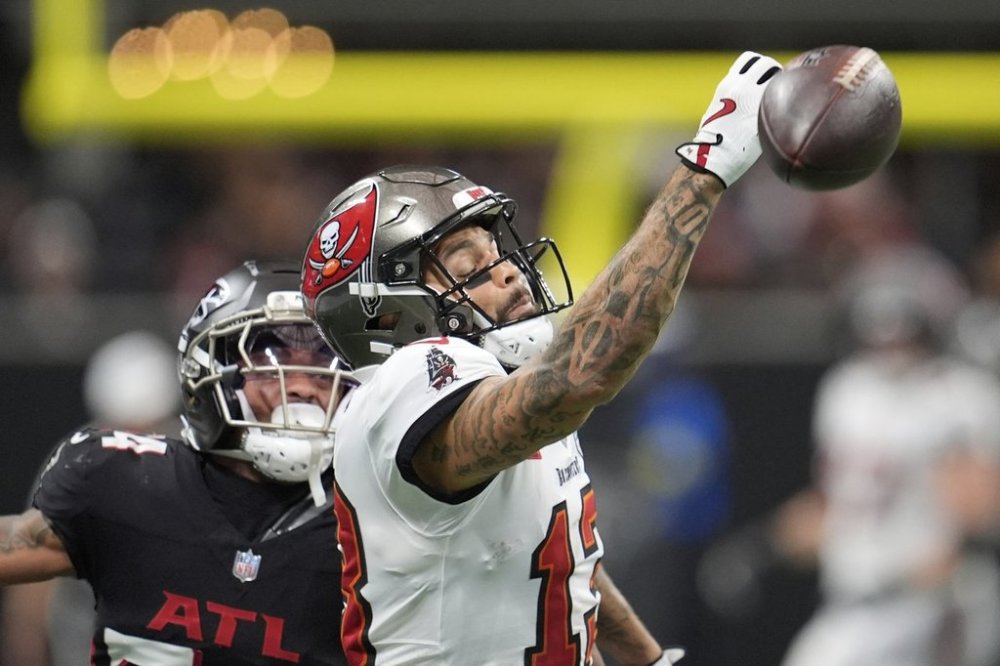 Tampa Bay Buccaneers wide receiver Mike Evans (13) gets an incomplete catch against Atlanta Falcons cornerback A.J. Terrell Jr. (24) during the second half of an NFL football game, Sunday, Sept. 7, 2025, in Atlanta. (AP Photo/Mike Stewart)