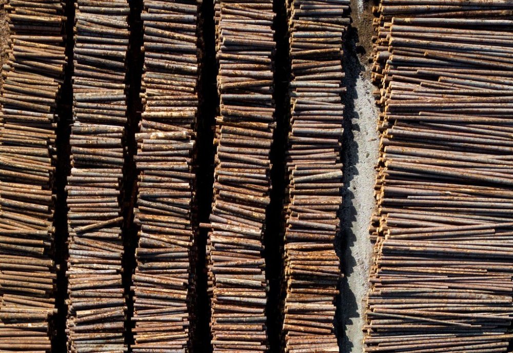 In an aerial view, logs are seen stacked at Gorman Brothers Lumber sawmill, in West Kelowna, B.C., on Friday, April 4, 2025. THE CANADIAN PRESS/Darryl Dyck