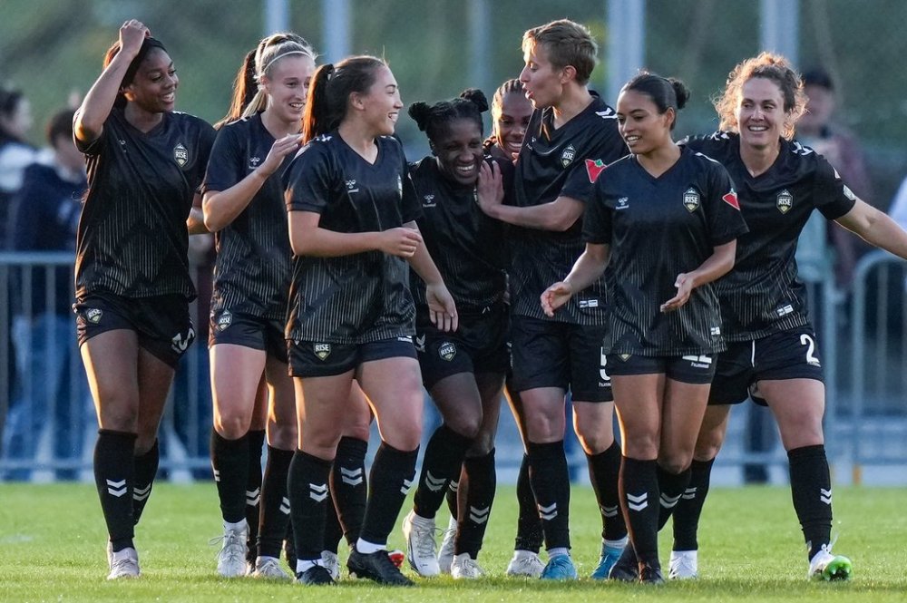 Vancouver Rise's Jasmyne Spencer, centre, celebrates with her teammates after scoring against the Halifax Tides during the second half of an NSL soccer match in Burnaby, B.C., on Monday, May 5, 2025. THE CANADIAN PRESS/Darryl Dyck