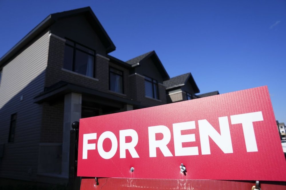 A for rent sign is displayed on a house in Ottawa on Friday, Oct. 14, 2022. THE CANADIAN PRESS/Sean Kilpatrick