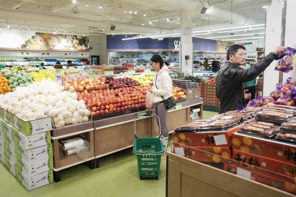 Customers shop for produce at T&T Supermarket's location in Toronto's Fairview Mall, Friday, Nov. 28, 2024. THE CANADIAN PRESS/Chris Young