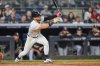 New York Yankees' José Caballero follows through on a walk-off RBI single during the ninth inning of a baseball game against the Chicago White Sox Tuesday, Sept. 23, 2025, in New York. (AP Photo/Frank Franklin II)