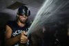 Toronto Blue Jays pitcher Kevin Gausman celebrates with teammates in the clubhouse after they clinched a playoff spot by defeating the Kansas City Royals on Sept. 21, 2025, in Kansas City, Mo. (AP Photo/Charlie Riedel)