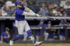 Toronto Blue Jays' Bo Bichette breaks his bat while hitting a run-scoring double during the first inning of a baseball game against the New York Yankees, Friday, Sept. 5, 2025, in New York. (AP Photo/Adam Hunger)