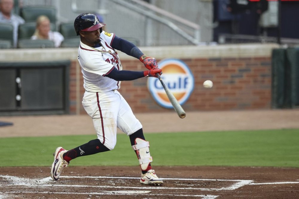 Atlanta Braves' Ozzie Albies hits a solo home run in the first inning of a baseball game against the Chicago Cubs, Monday, Sept. 8, 2025, in Atlanta. (AP Photo/Colin Hubbard)