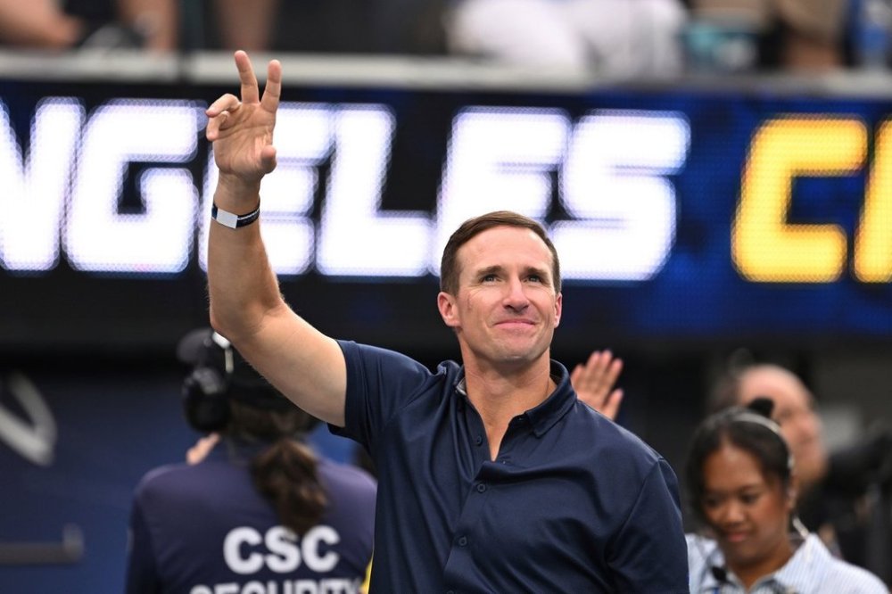 FILE - Drew Brees waves to the crowd during the first half of an NFL football game between the Los Angeles Chargers and the Denver Broncos, Sunday, Sept. 21, 2025, in Inglewood, Calif. (AP Photo/Carrie Giordano, file)