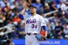 New York Mets' Kodai Senga pauses before pitching during the first inning of a baseball game against the Miami Marlins, Sunday, Aug. 31, 2025, in New York. (AP Photo/Noah K. Murray)