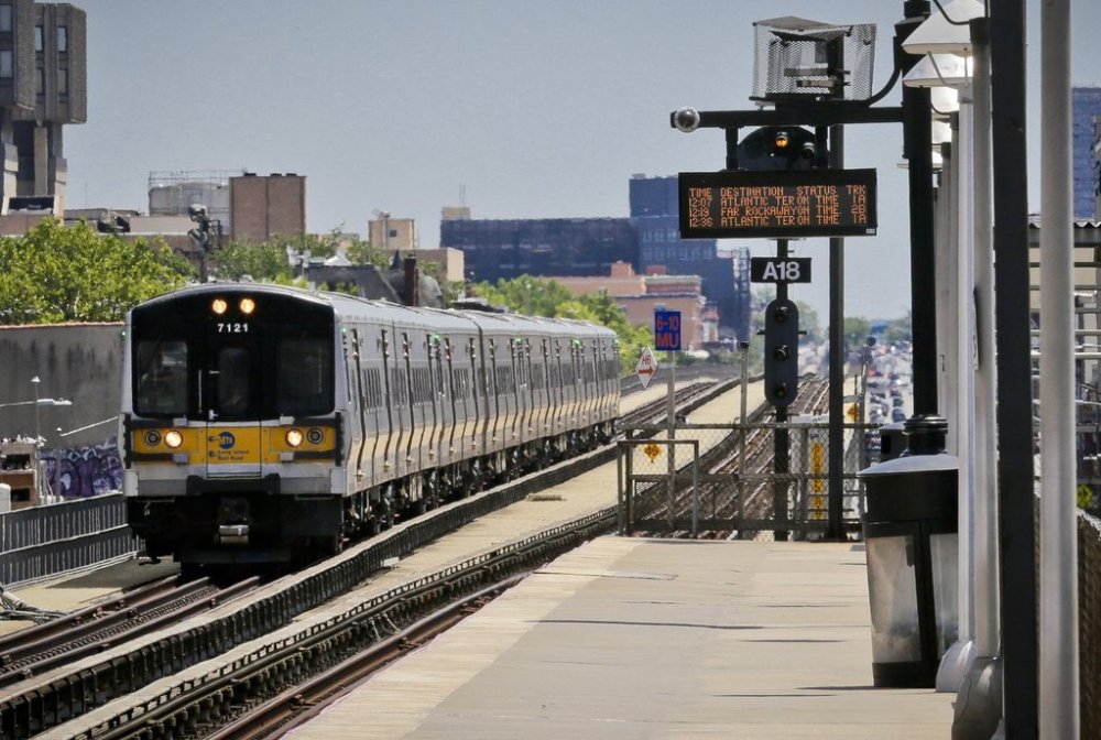 FILE - An Atlantic Terminal bound LIRR train arrives at the Nostrand Avenue station, July 9, 2017, in New York. (AP Photo/Bebeto Matthews, File)