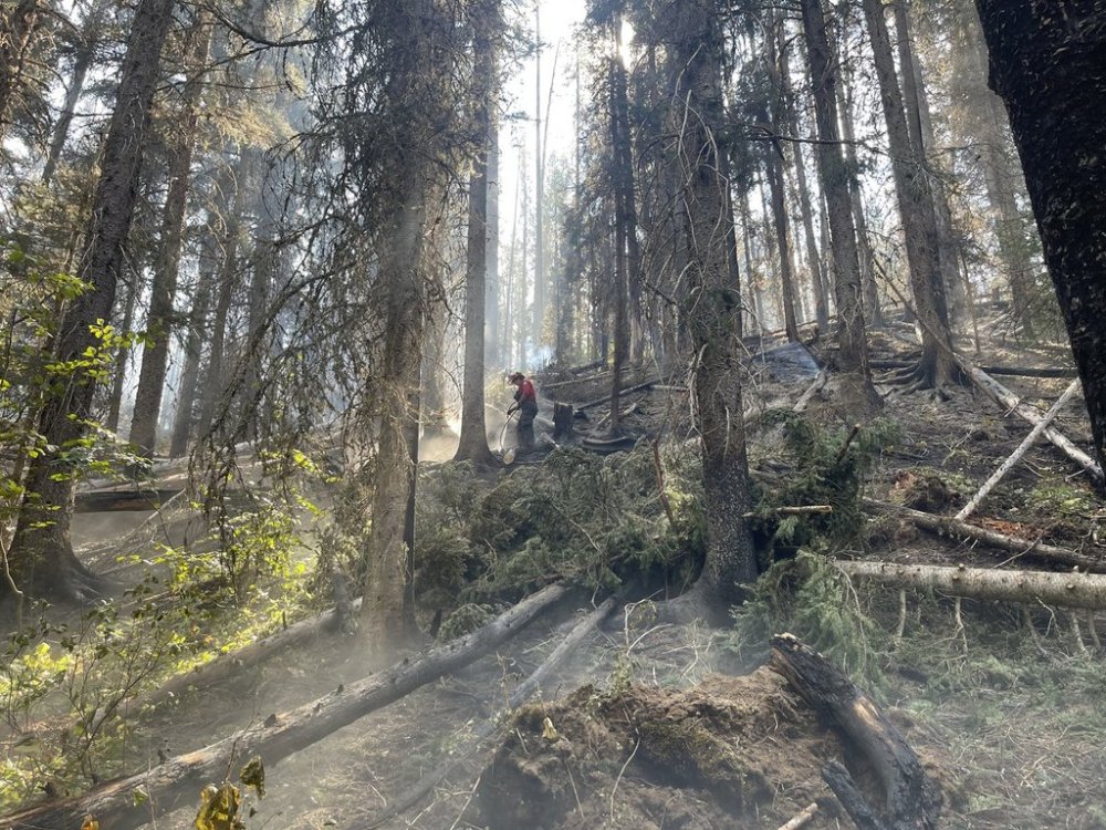A fire crew member works on the Mine Creek wildfire between Hope and Merritt, B.C., in this handout photo, on Tuesday, Sept. 9, 2025. THE CANADIAN PRESS/Handout- BC Wildfire Service (Mandatory Credit)