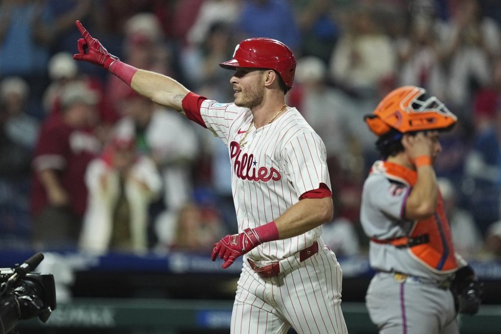 Philadelphia Phillies' Max Kepler celebrates after hitting a home run off of New York Mets pitcher Ryan Helsley during the eighth inning of a baseball game, Wednesday, Sept. 10, 2025, in Philadelphia. (AP Photo/Matt Rourke)