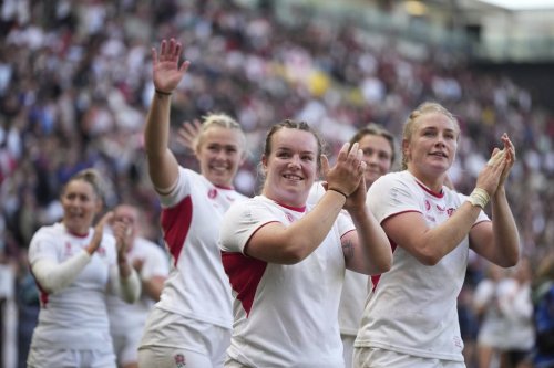 England players celebrate after defeating France during the Women's Rugby World Cup 2025 semifinal match between France and England in Bristol, England, Saturday, Sept. 20, 2025.(AP Photo/Alastair Grant)