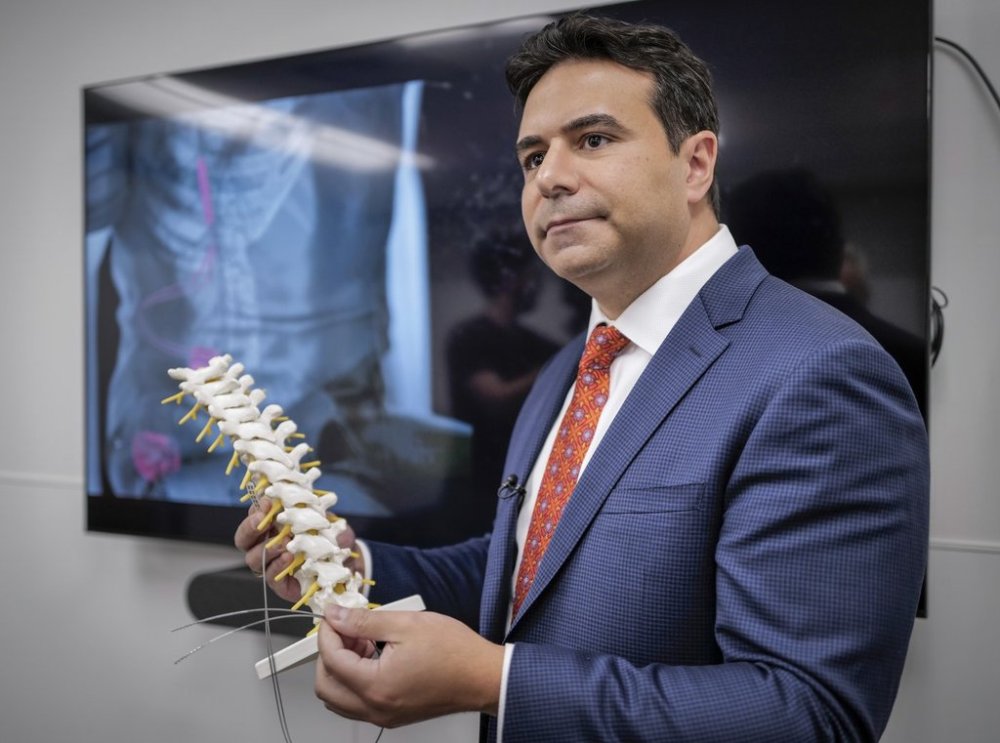 University of Calgary associate professor of neurosurgery Dr. Fady Girgis explains a new implant that restores blood pressure balance after spinal cord injury in Calgary, Tuesday, Sept. 16, 2025.THE CANADIAN PRESS/Jeff McIntosh
