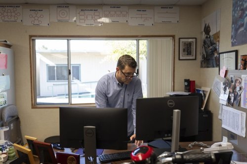 Casey Cuny, an English teacher at Valencia High School, works on his computer as he prepares for class in Santa Clarita, Calif., Wednesday, Aug. 27, 2025. (AP Photo/Jae C. Hong)