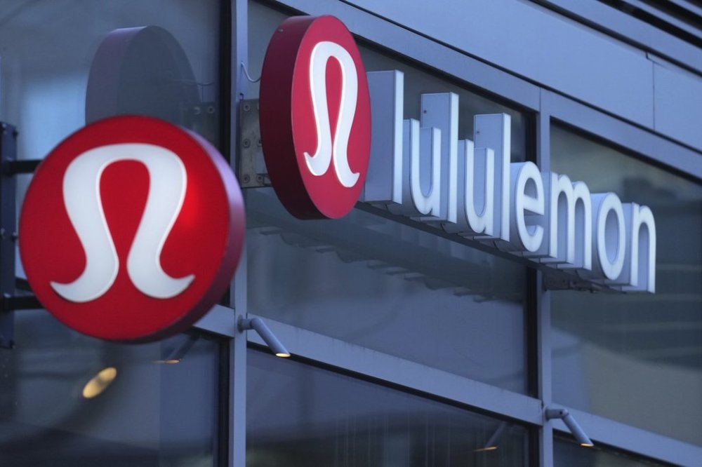 Lululemon signs are displayed outside a retail location in the Seaport District, Dec. 13, 2024, in Boston. (AP Photo/Charles Krupa, File)