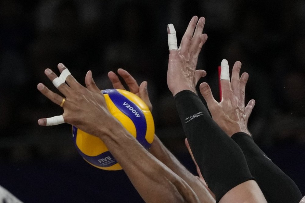 Canada's players block a ball during the group A men's volleyball match between France and Canada at the 2024 Summer Olympics, Tuesday, July 30, 2024, in Paris, France. THE CANADIAN PRESS/AP, Dolores Ochoa